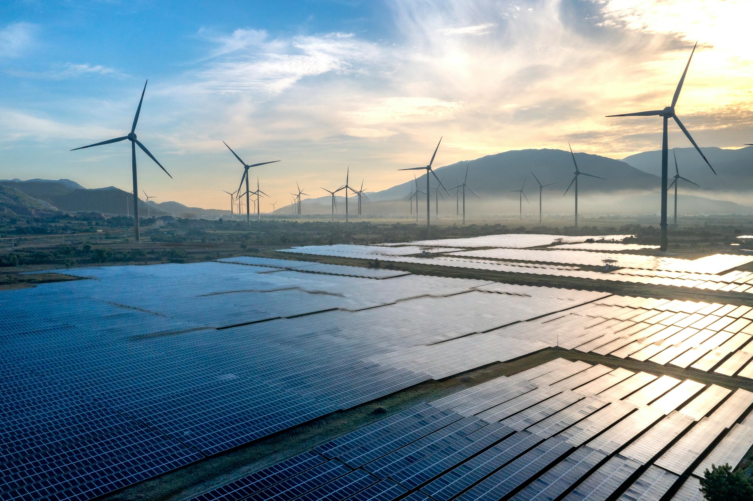 Scenic view of wind turbines and solar panels in Ninh Thuan, Vietnam, capturing sustainable energy efforts.